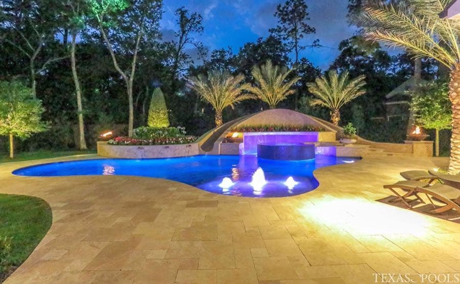 Vanishing-edge pool overlooking wooded backyard